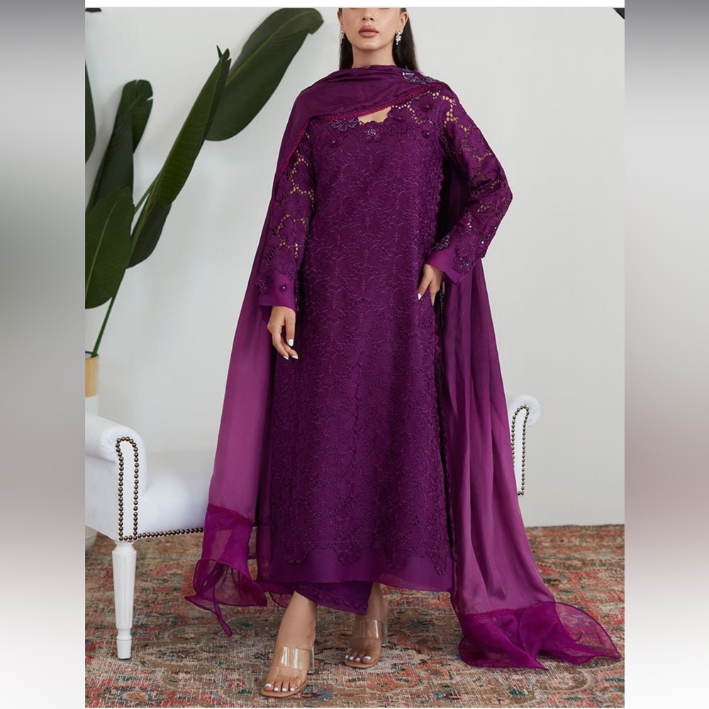 Farah Talib Aziz suit.